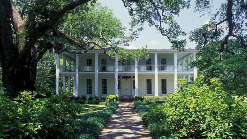white plantation house with columns
