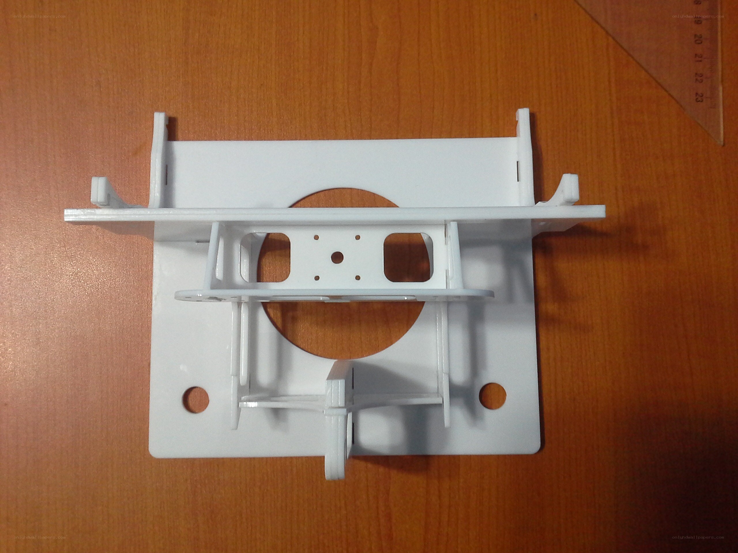 white plastic bracket on table