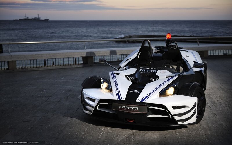 white police car by the sea