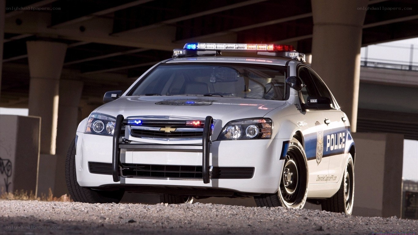 white police car under bridge