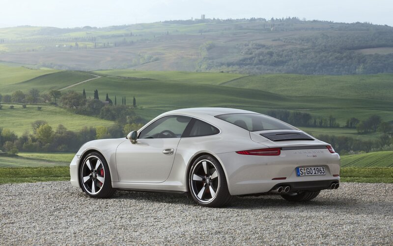 White Porsche 911 on gravel