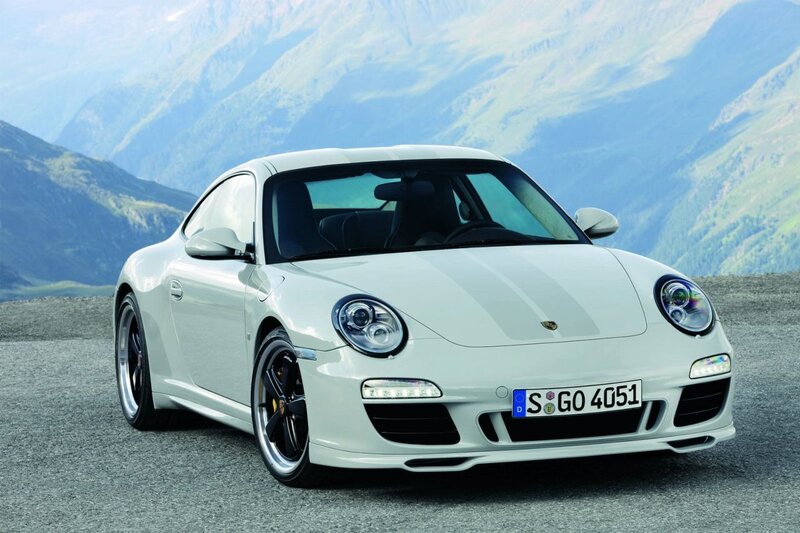 White Porsche 911 on mountain road