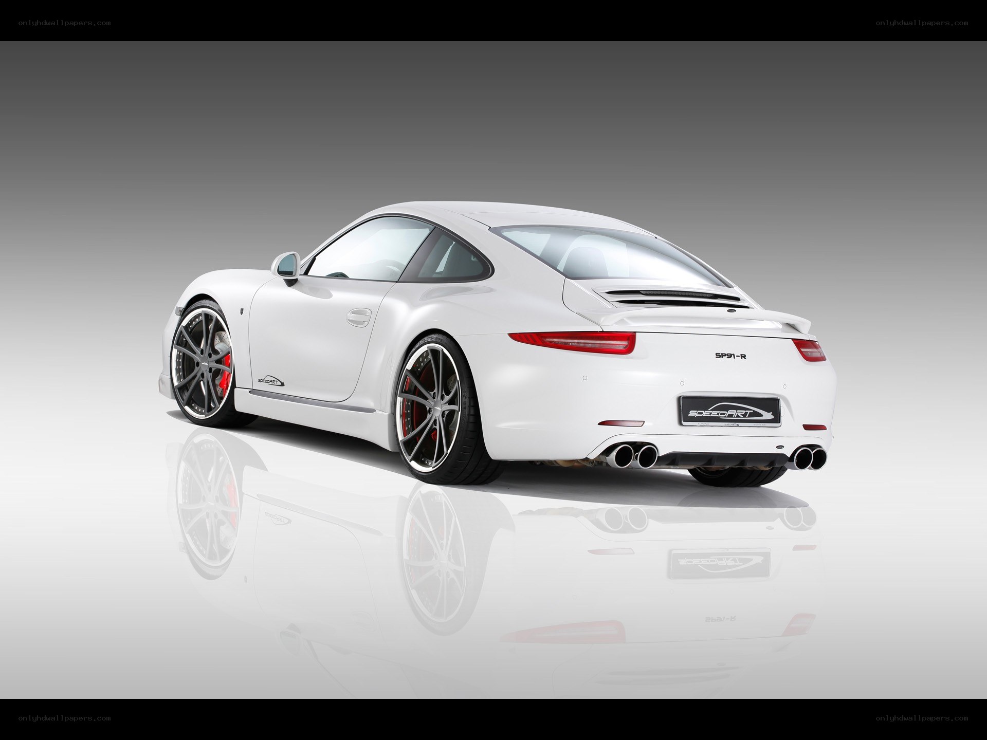 White Porsche 911 with custom wheels