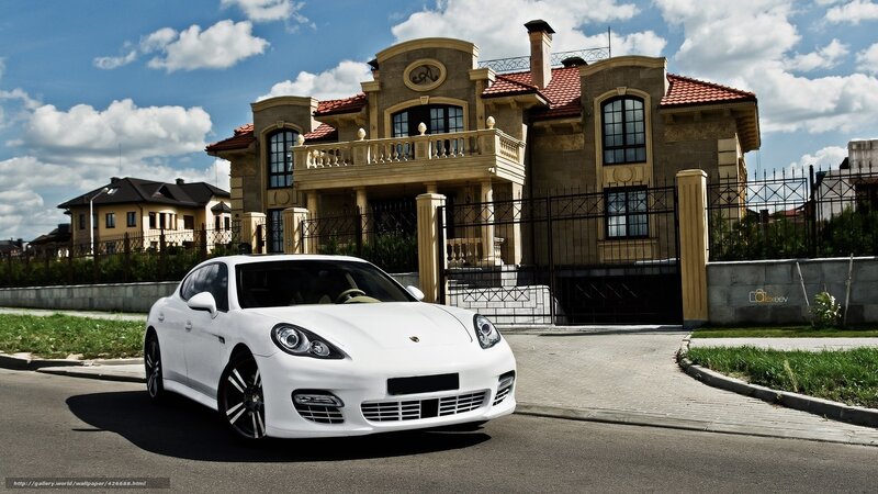 White Porsche at luxury home