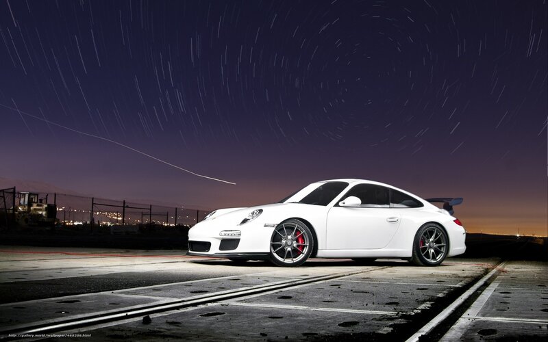 White Porsche at night with star trails