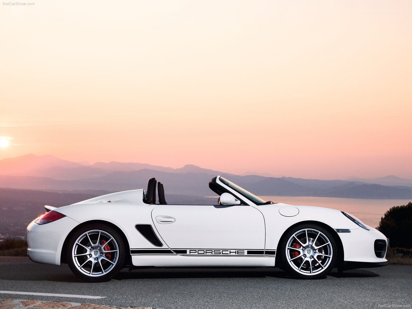 White Porsche Boxster at sunset