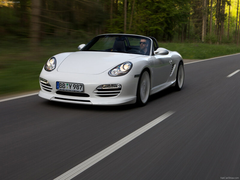 White Porsche Boxster driving on road