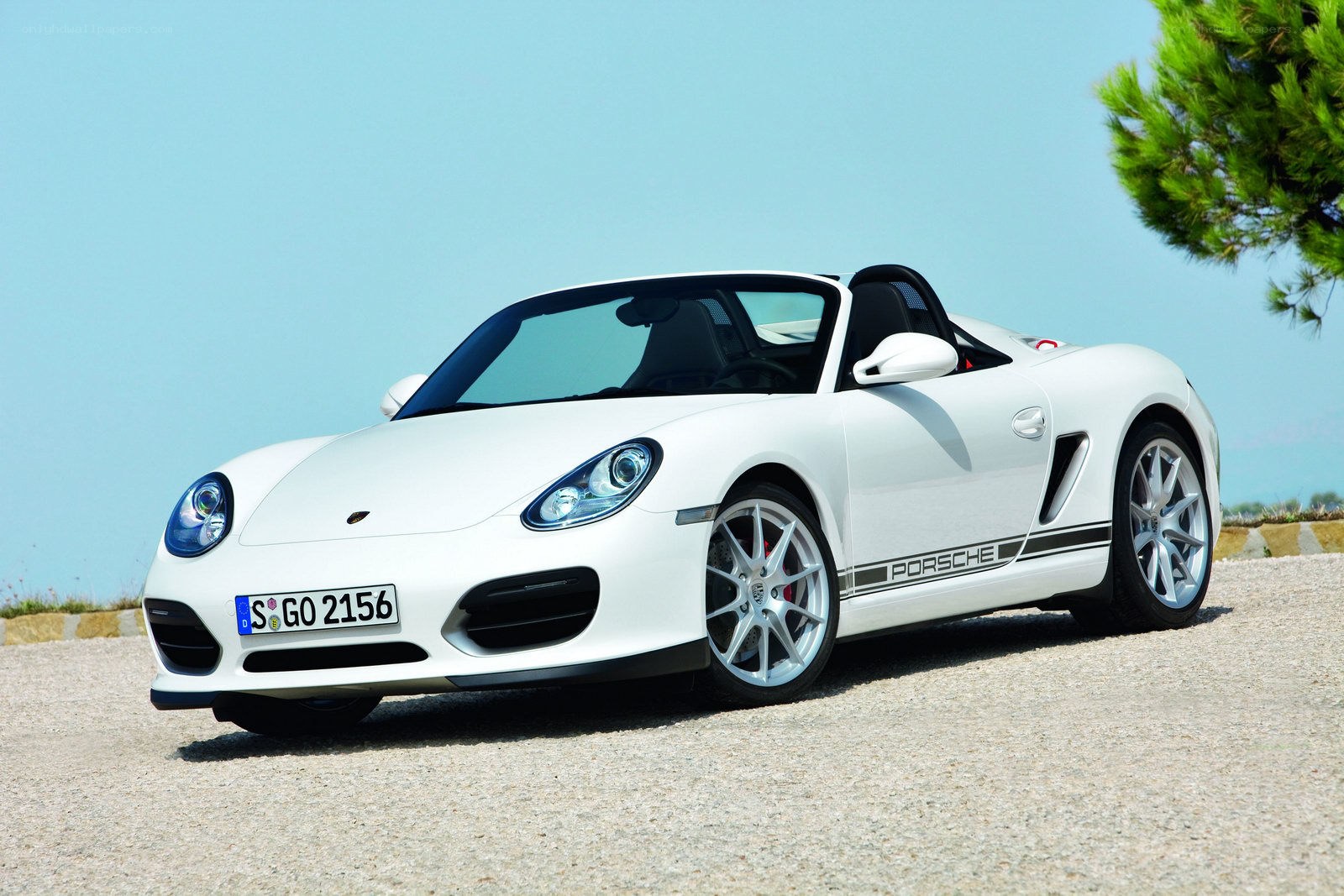 White Porsche Boxster parked