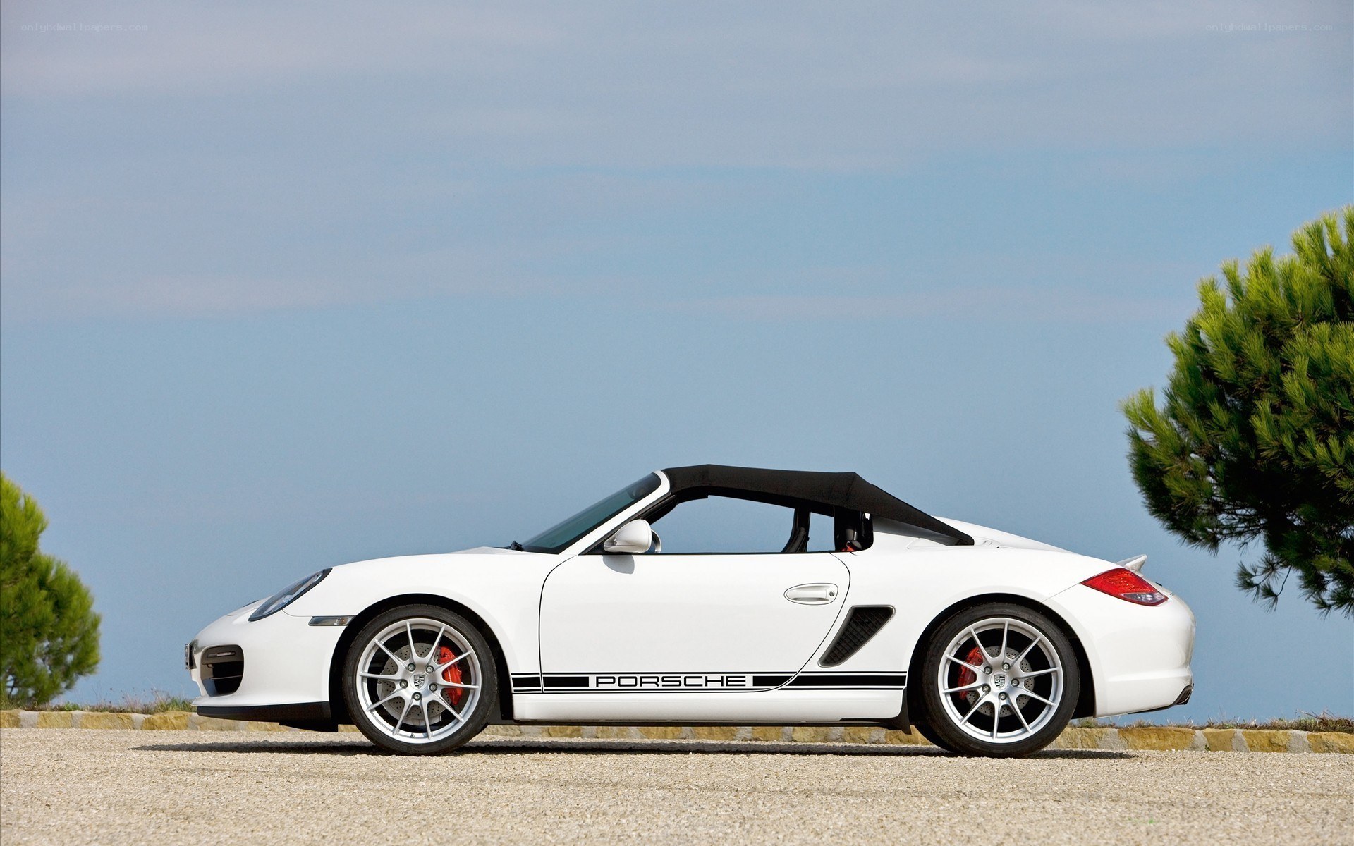 White Porsche Boxster parked
