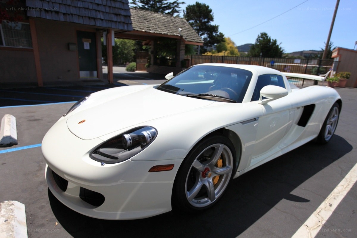 White Porsche Carrera GT parked