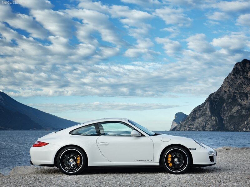 White Porsche Carrera GTS by lake