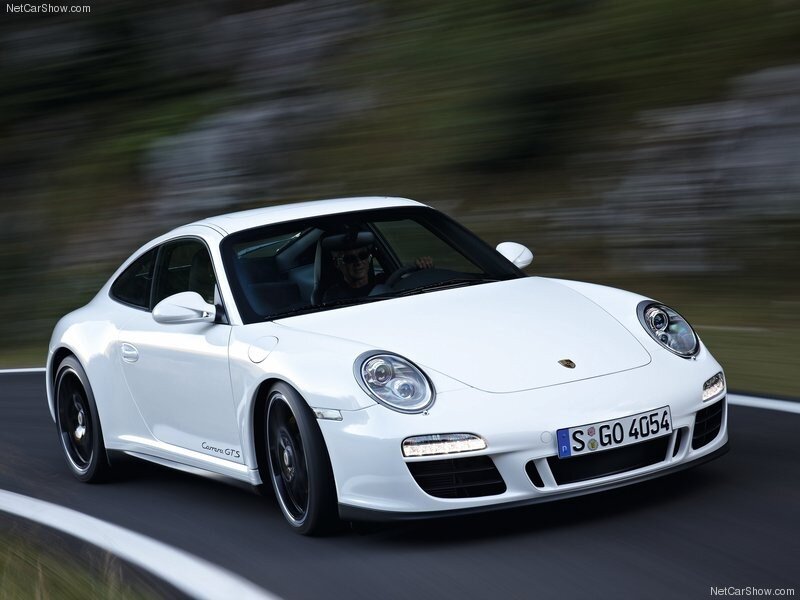 White Porsche Carrera GTS in motion