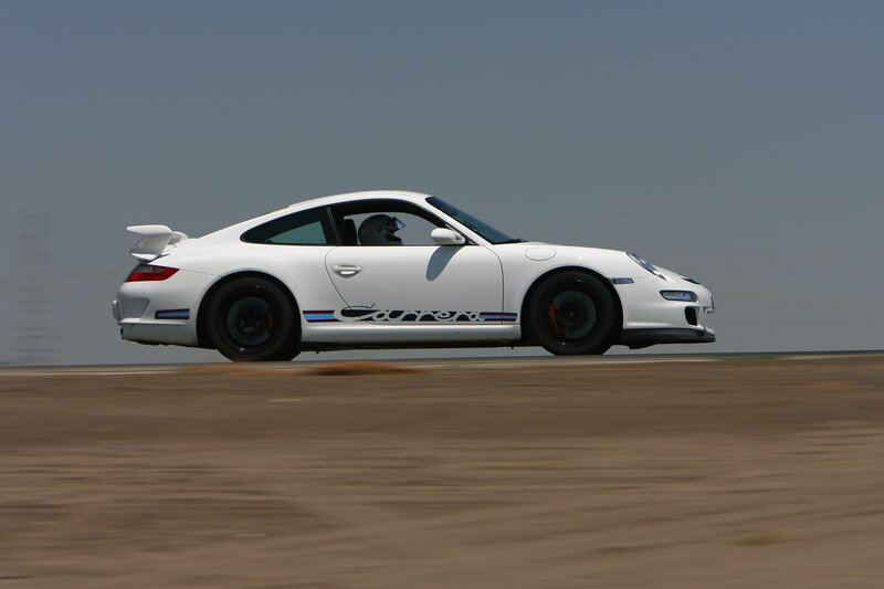 white porsche carrera on track