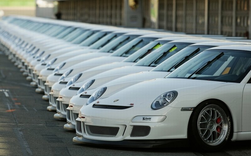 White Porsche cars in a row