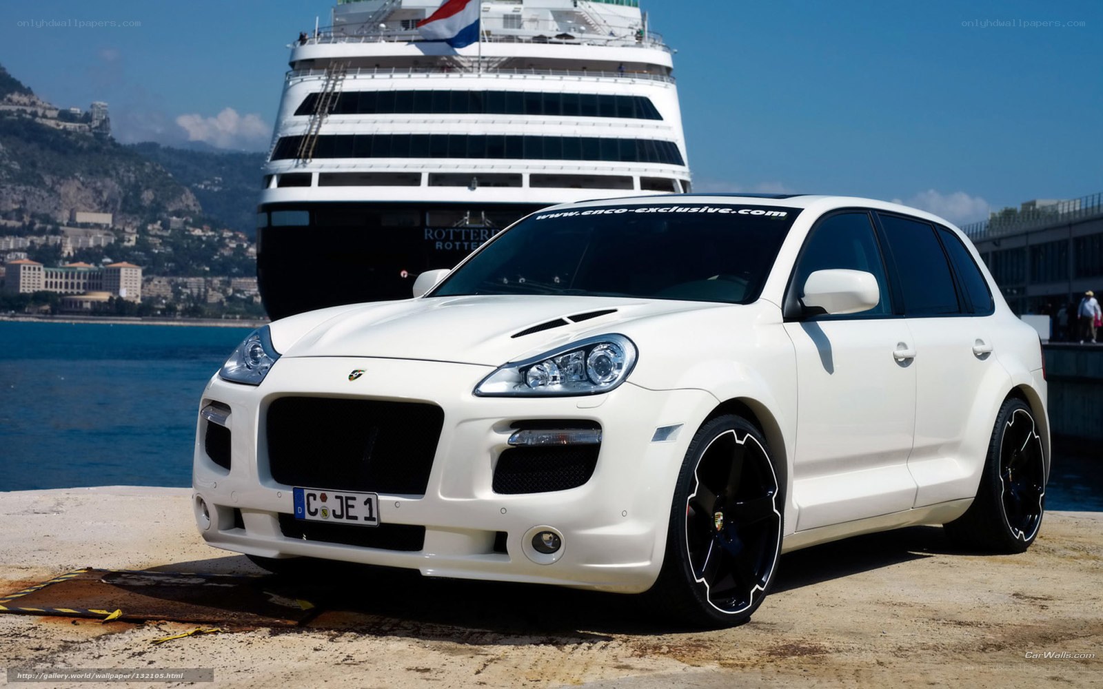 White Porsche Cayenne at port
