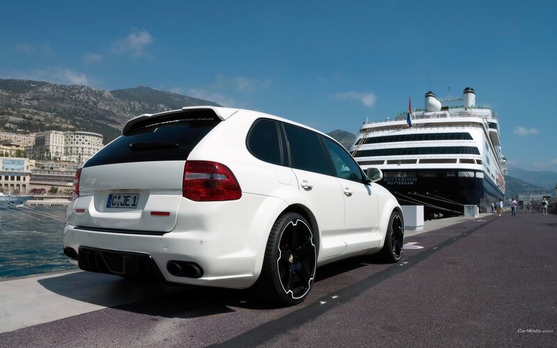 White Porsche Cayenne parked at port