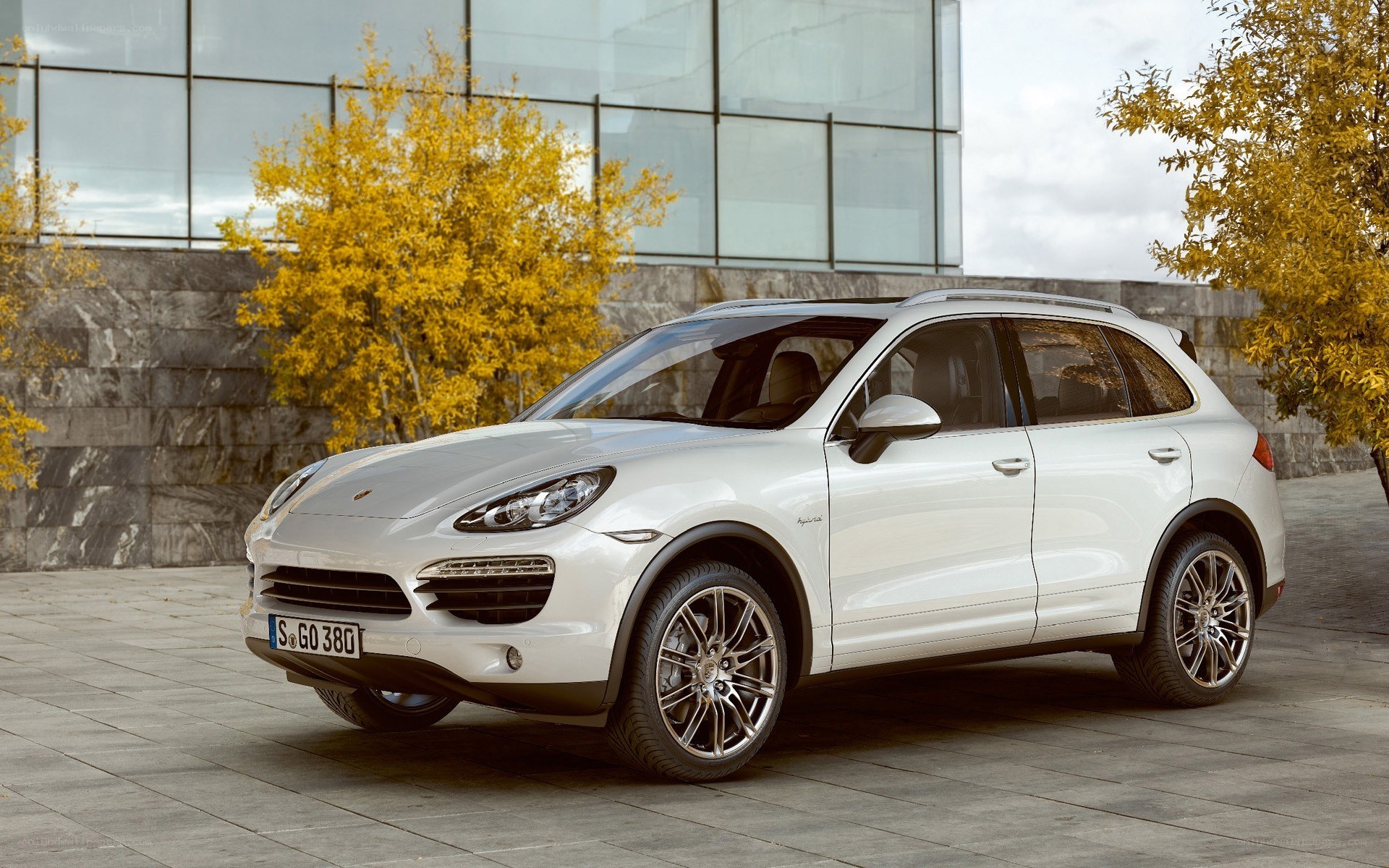 White Porsche Cayenne parked outside