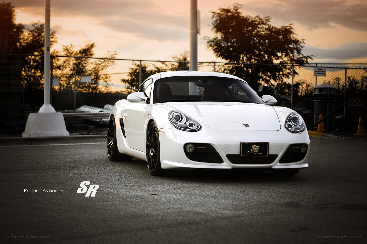 White Porsche Cayman at sunset