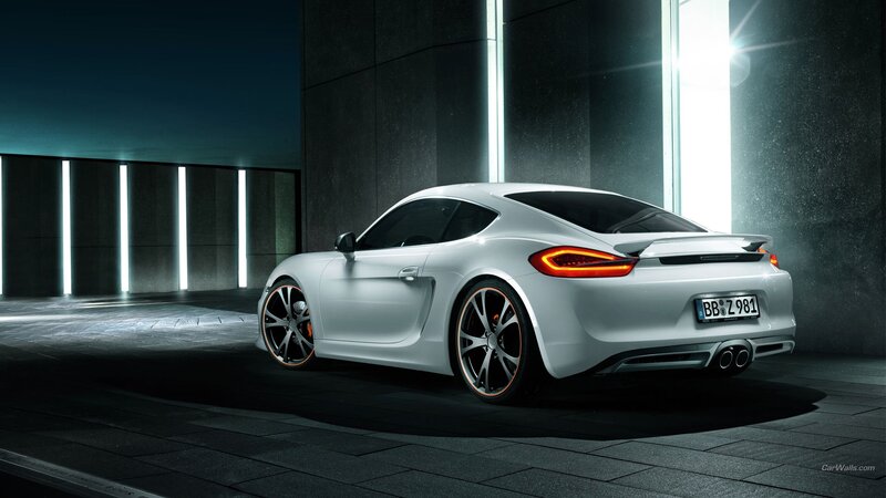 White Porsche Cayman in a modern garage
