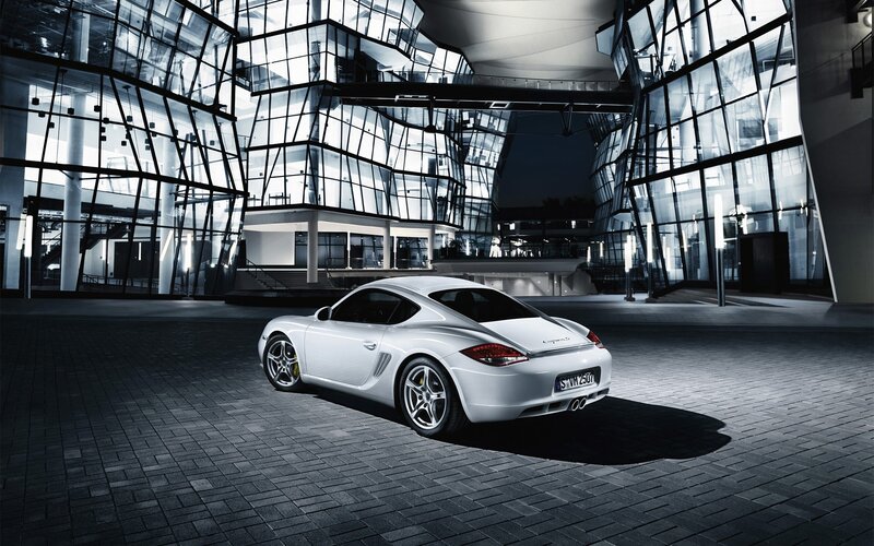 White Porsche Cayman in modern architecture