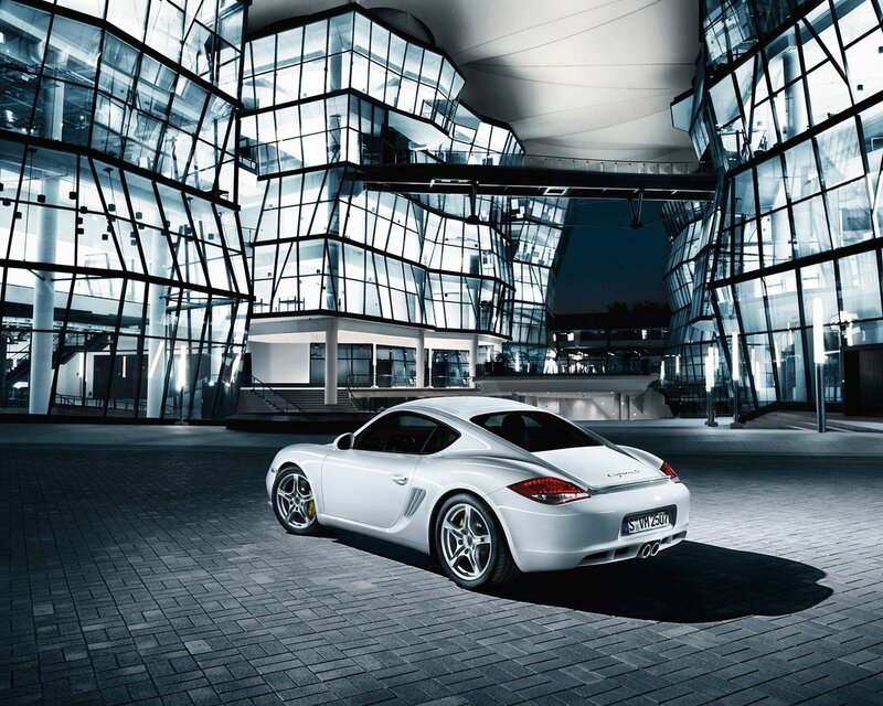 White Porsche Cayman in modern architecture