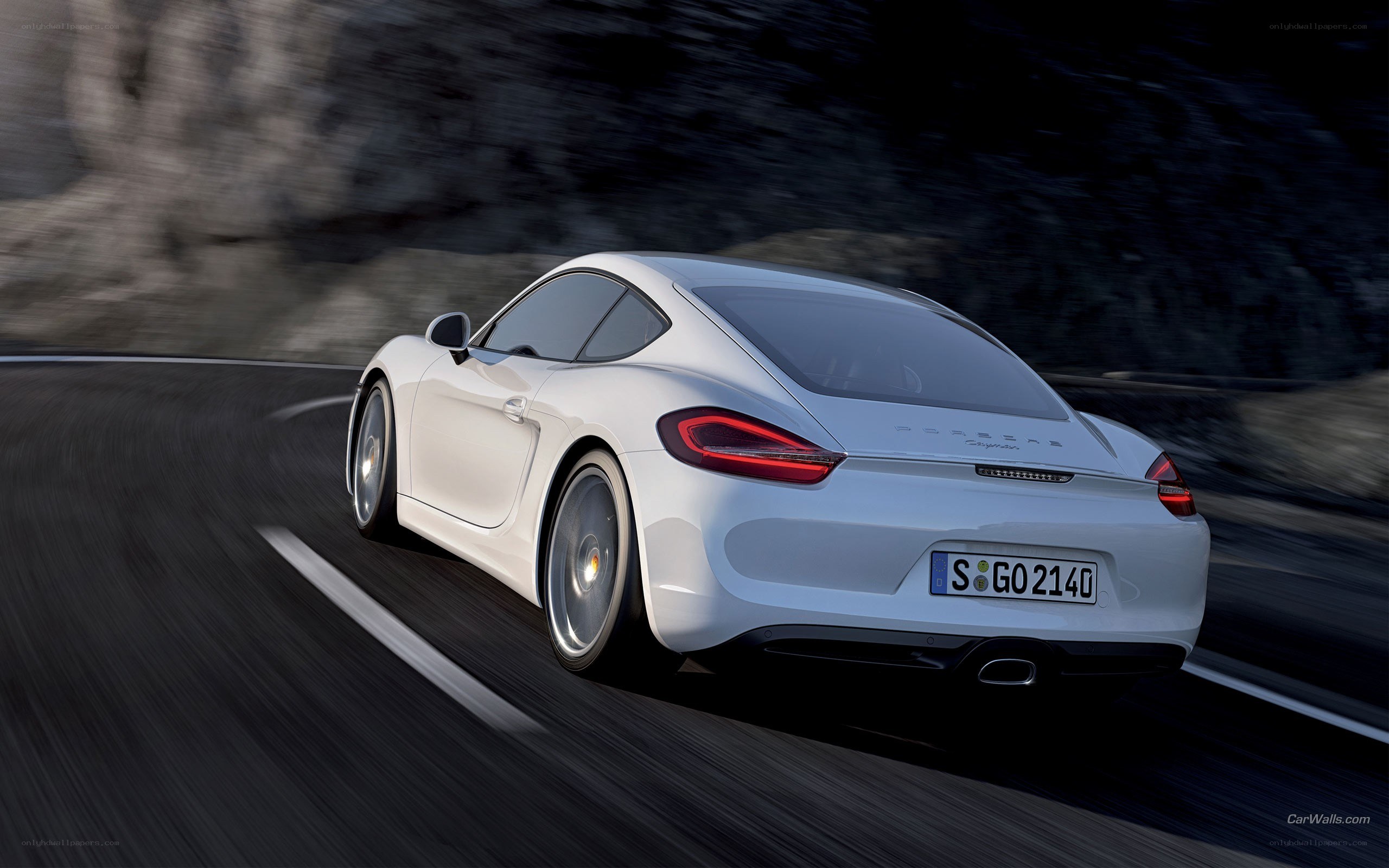 white porsche cayman in motion