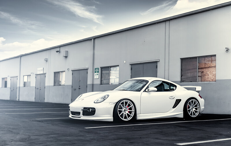 White Porsche Cayman in parking lot