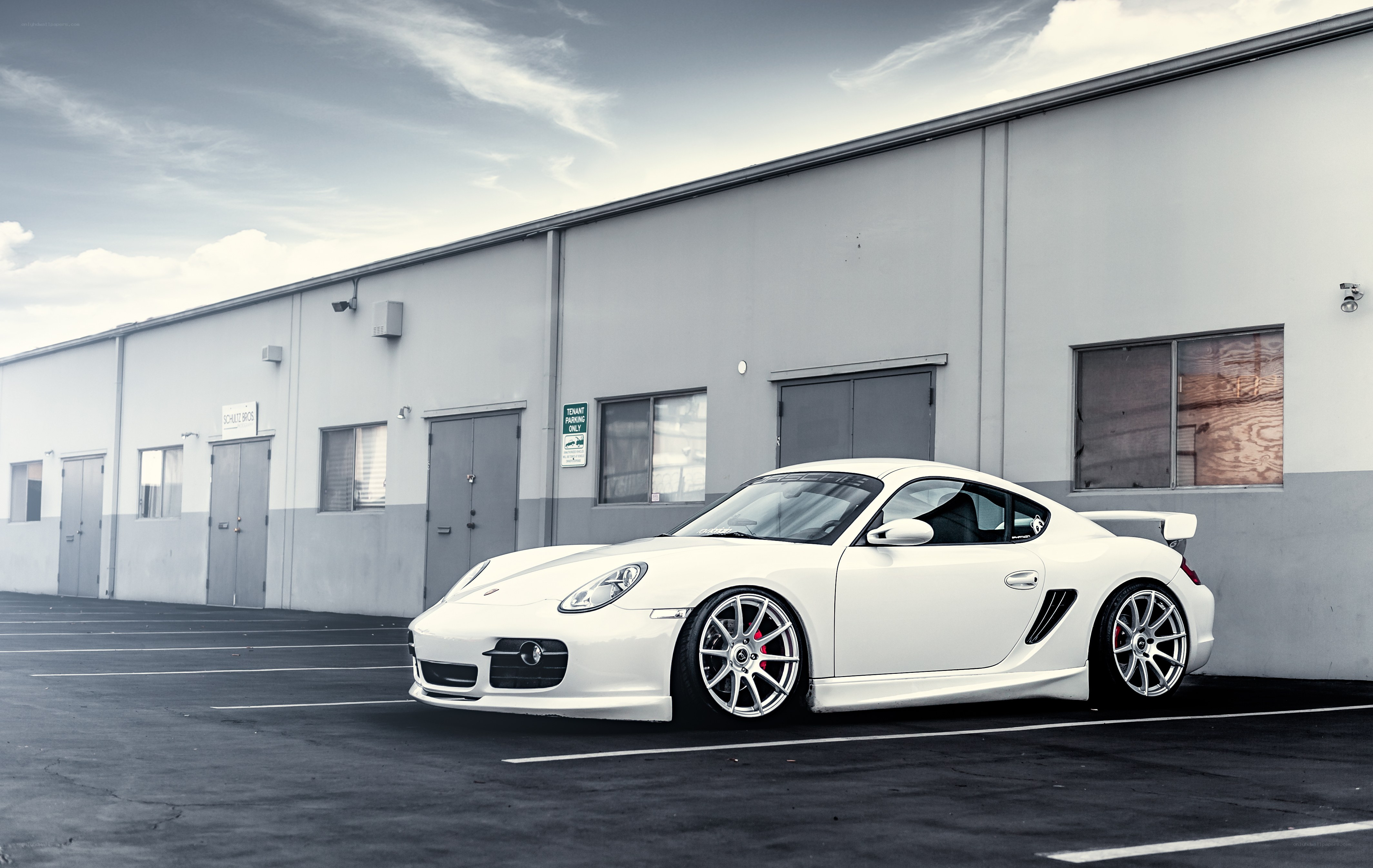 White Porsche Cayman in parking lot