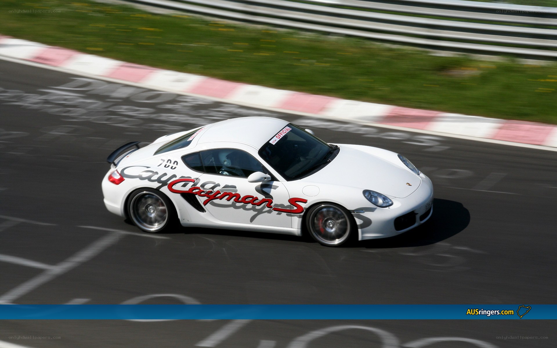 White Porsche Cayman S on track