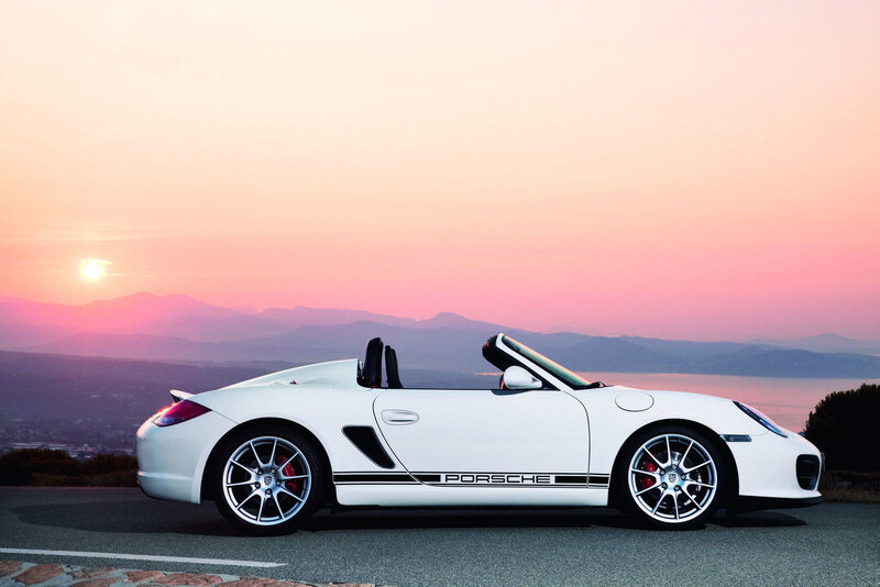 White Porsche convertible at sunset