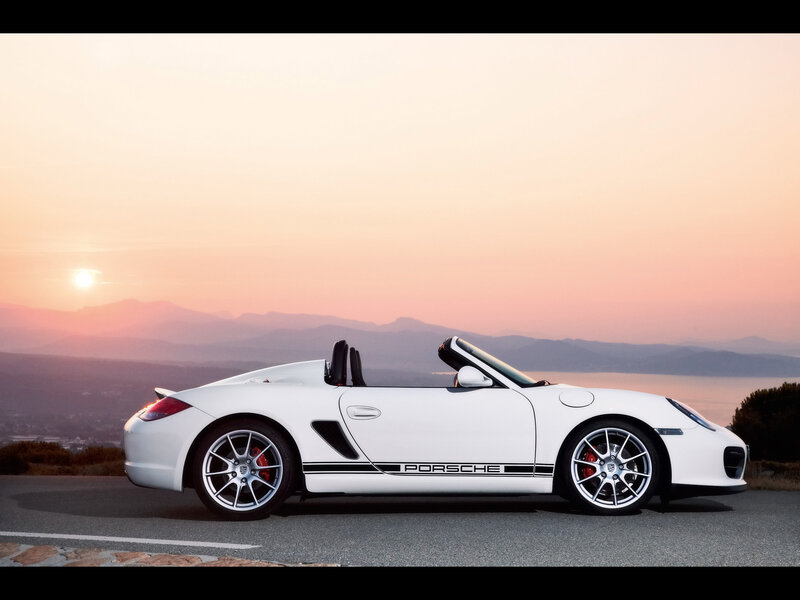 White Porsche convertible at sunset