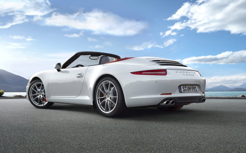 White Porsche convertible by the lake