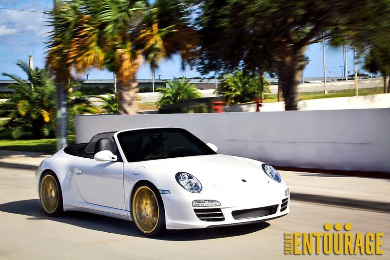 White Porsche convertible in motion