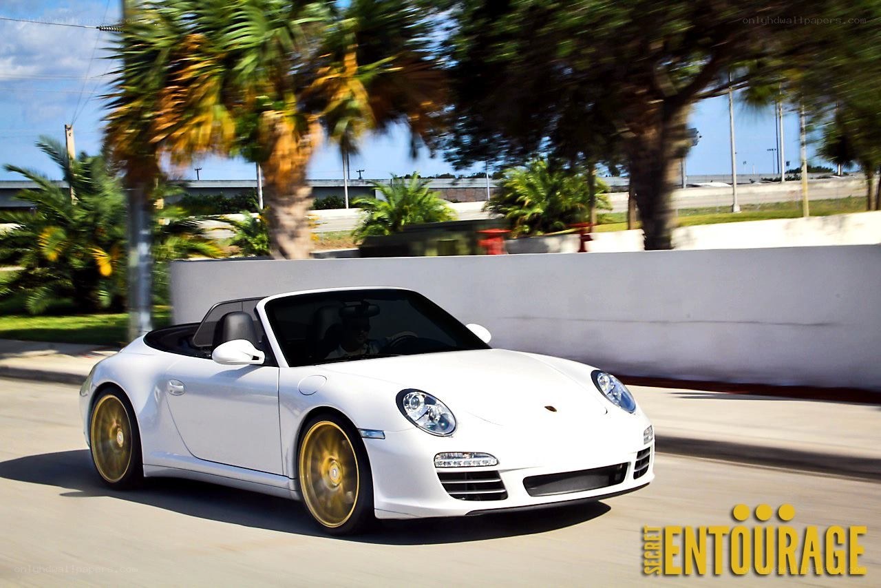 White Porsche convertible in motion