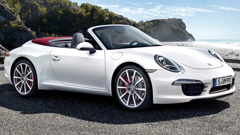 White Porsche convertible on beach