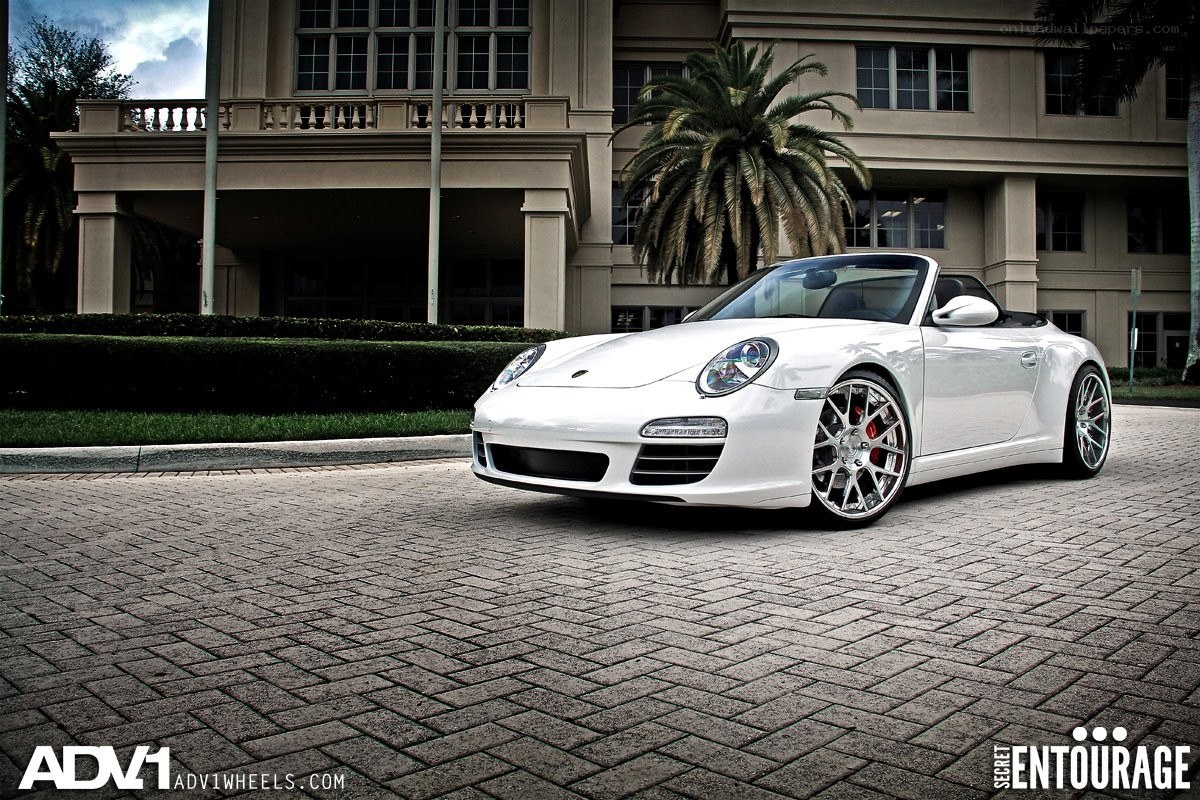 White Porsche convertible on driveway