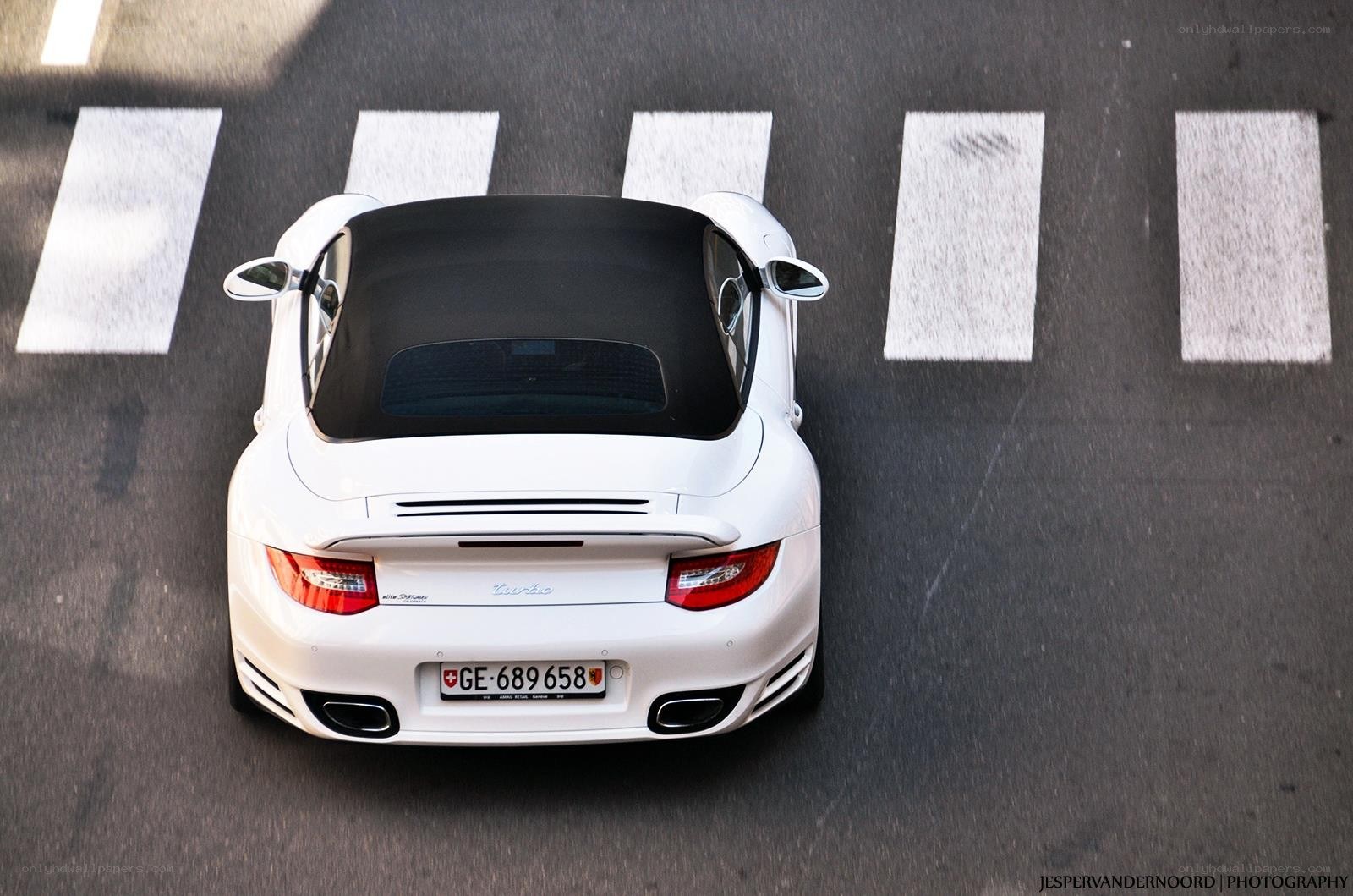 White Porsche convertible on road