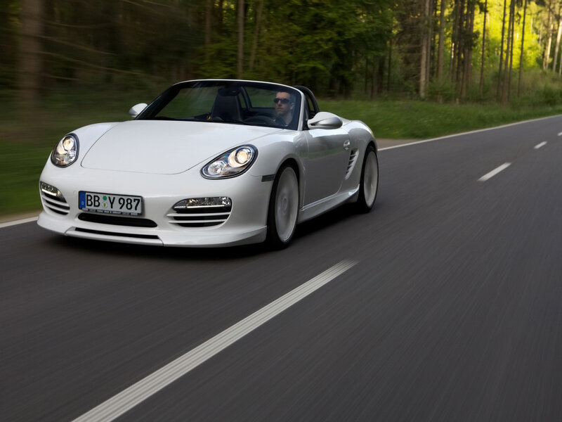 White Porsche convertible on road