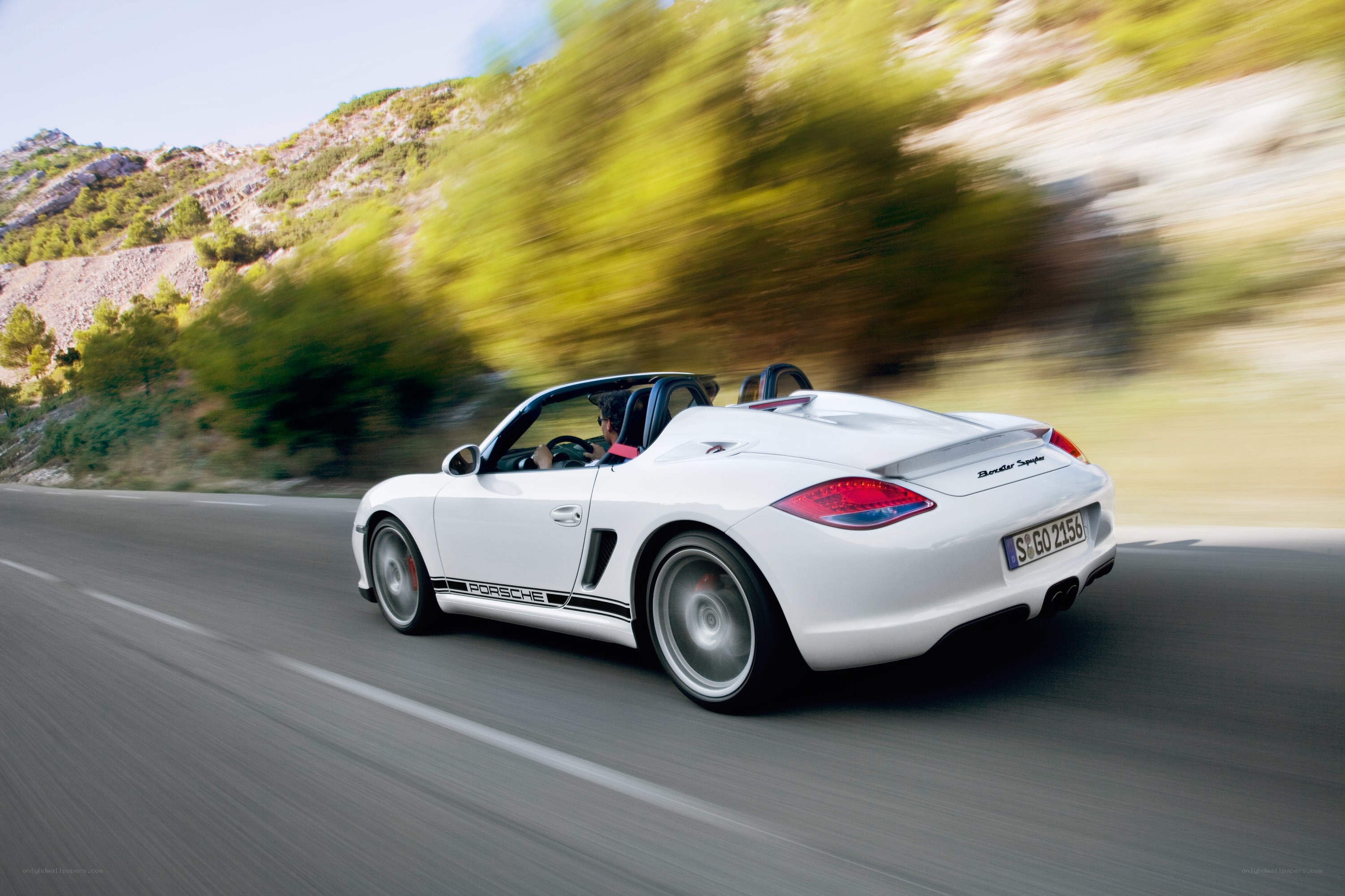 White Porsche convertible on road