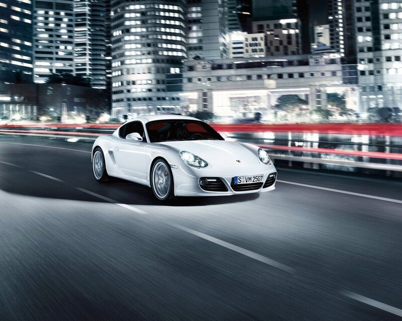 White Porsche driving at night