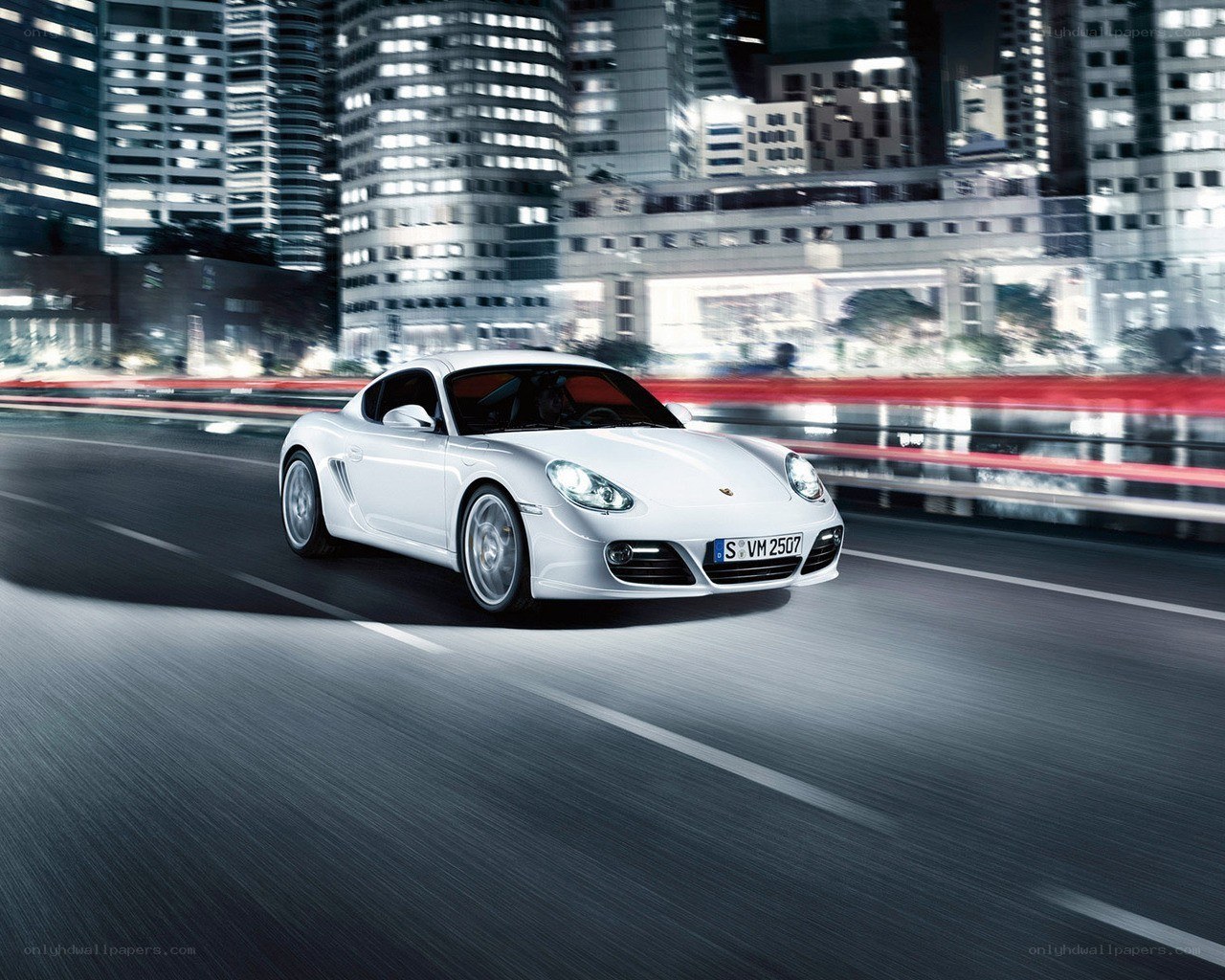 White Porsche driving at night