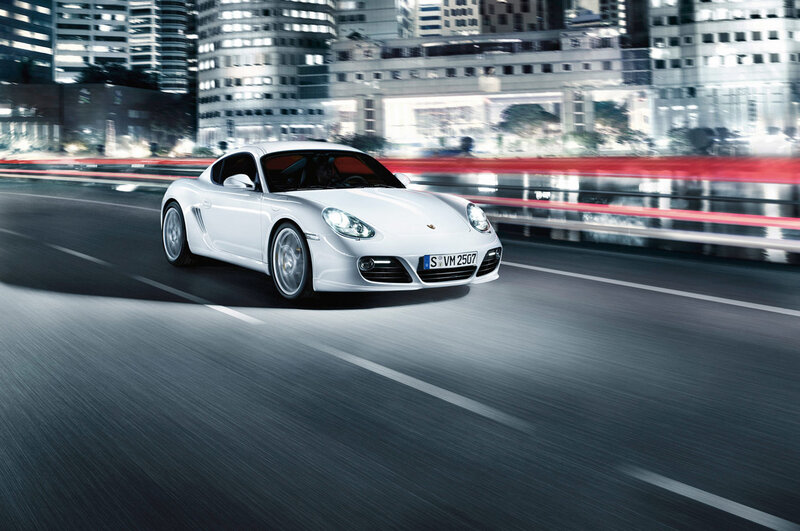 White Porsche driving at night