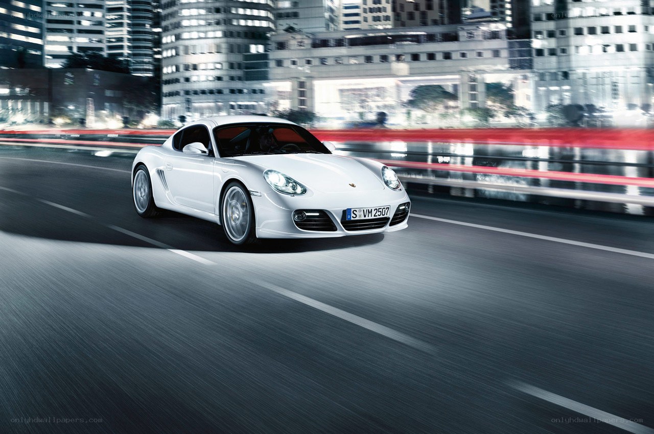White Porsche driving at night