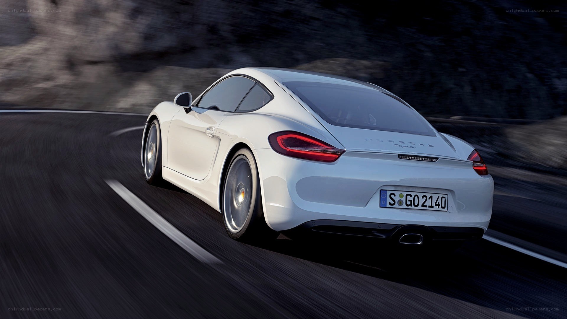 white porsche driving on road
