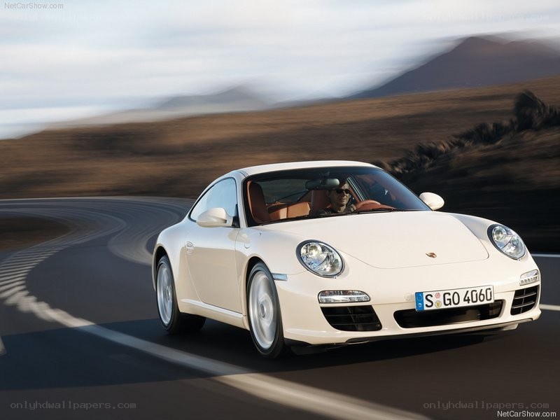 white porsche driving on road