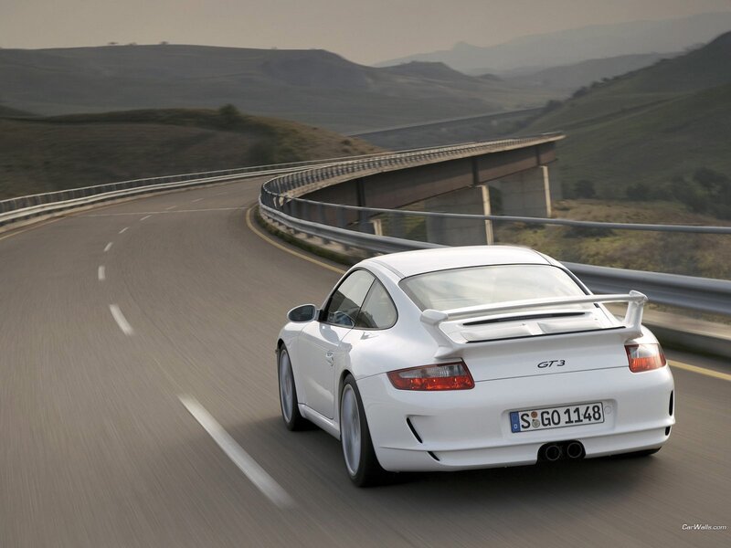 white porsche gt3 on winding road
