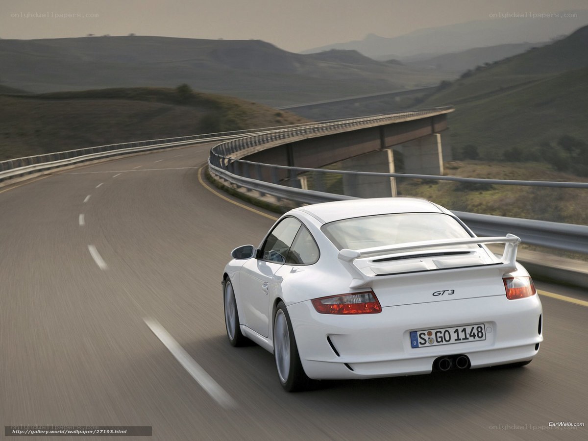 White Porsche GT3 on winding road