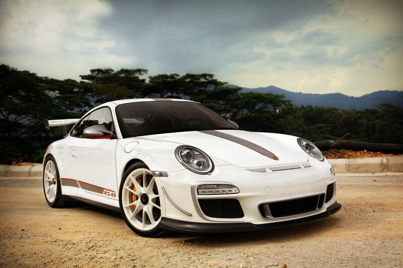 White Porsche GT3 RS on a dirt road