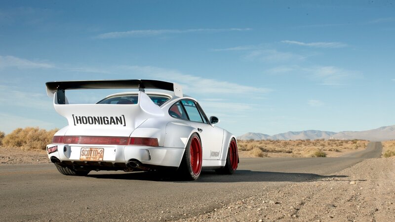 white Porsche in desert