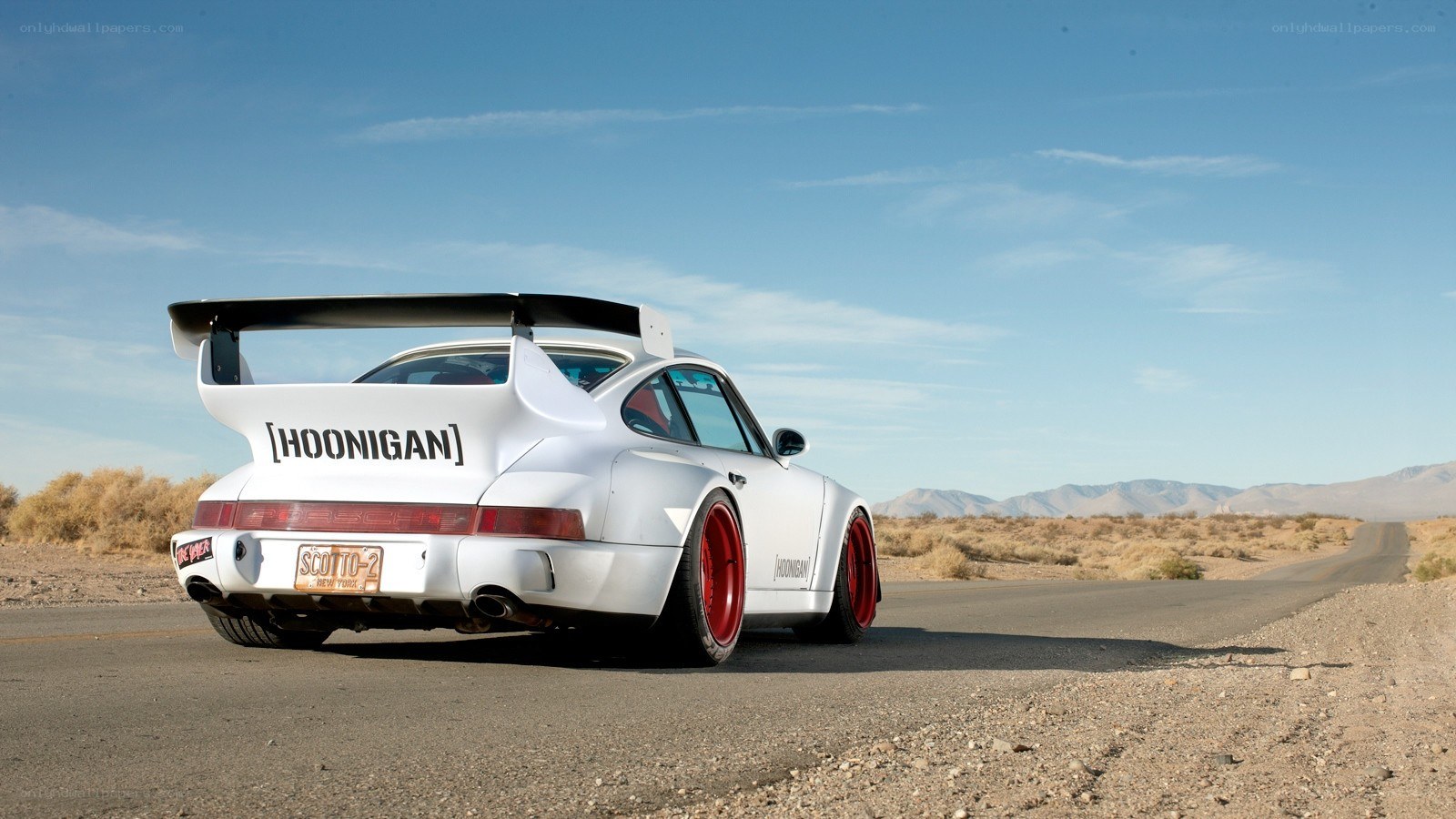 white Porsche in desert